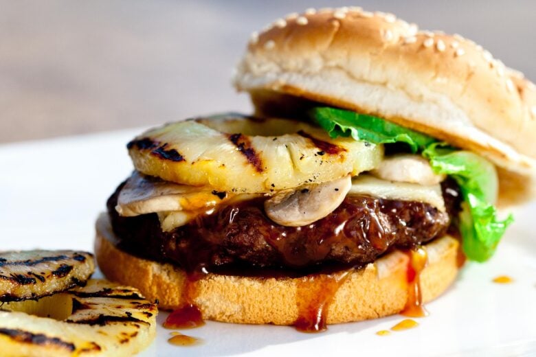 Teriyaki burgers with beef patty, grilled pineapples, and sauce
