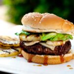Teriyaki burgers with beef patty, grilled pineapples, and sauce