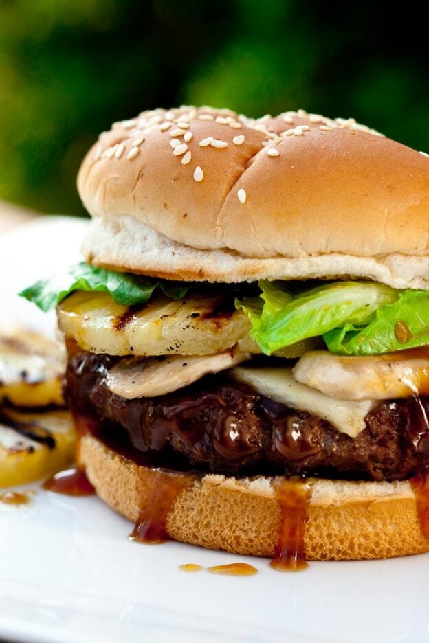 Teriyaki burgers with beef patty, grilled pineapples, and sauce