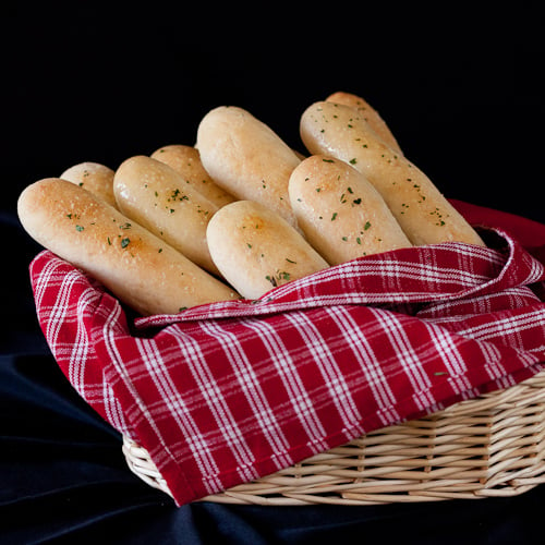 A bassinet of olive garden breadsticks