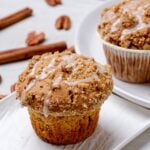 sweet potato muffins with streusel and icing on top.