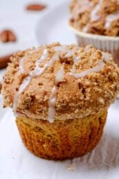 sweet potato muffins with streusel and icing on top.
