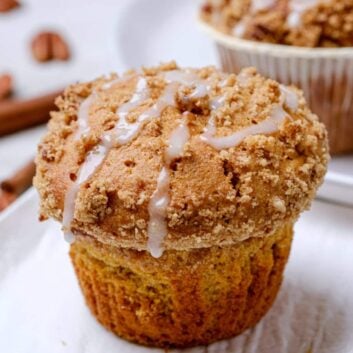 sweet potato muffins with streusel and icing on top.