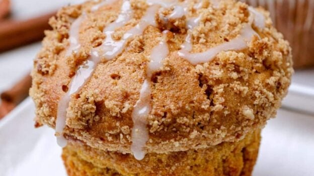 sweet potato muffins with streusel and icing on top.