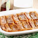 French toast bake using Texas Toast sliced bread, finished baking in a pan and sliced to serve.