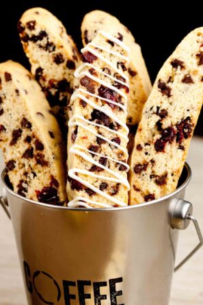 Almond biscotti arranged in a coffee tin.