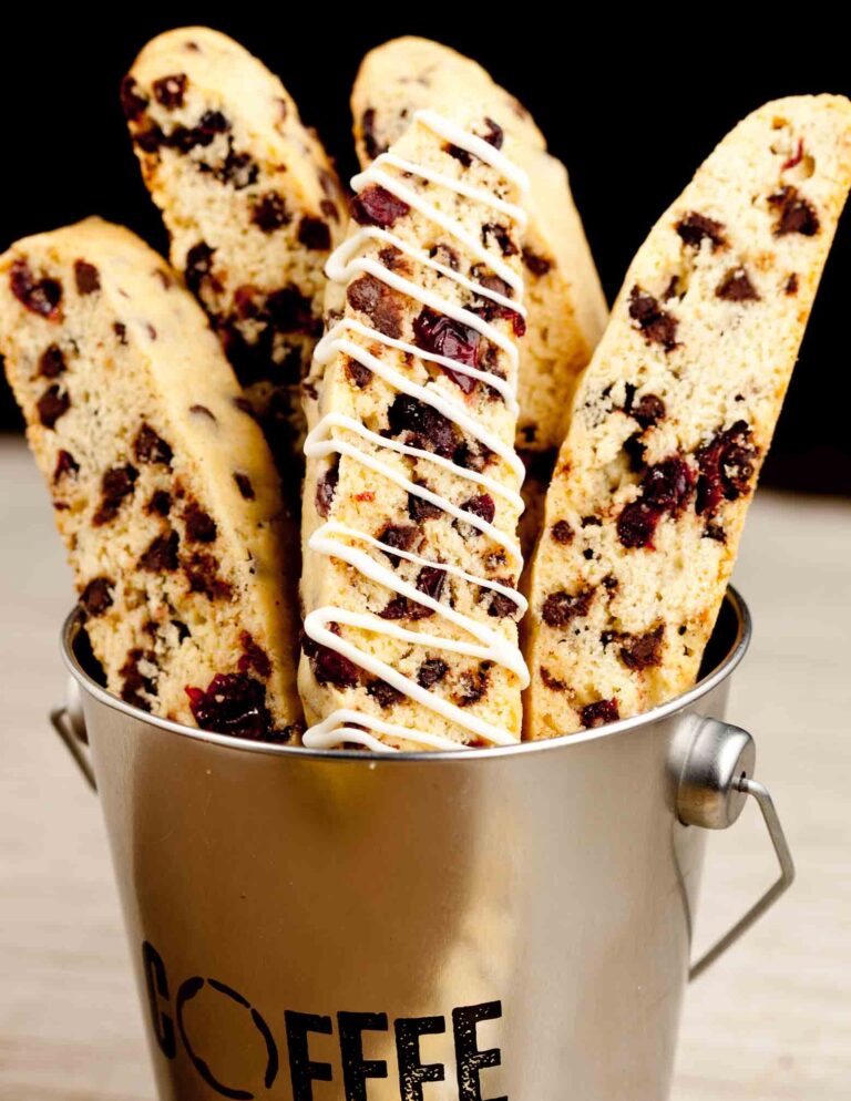 Almond biscotti arranged in a coffee tin.