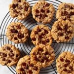 oatmeal chocolate chip cookies on a wire cooling rack.