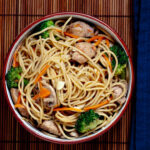 Chicken Chow Mein with Vegetables and chopsticks