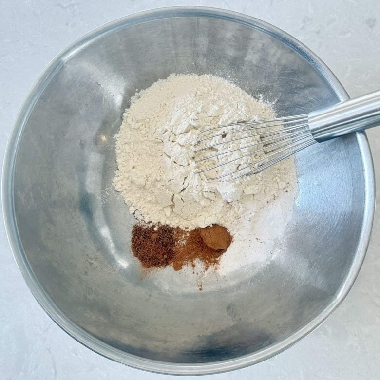 Oatmeal Chocolate Chip Cookies Flour, Cinnamon, Nutmeg, Salt, Baking Powder in Mixing Bowl.