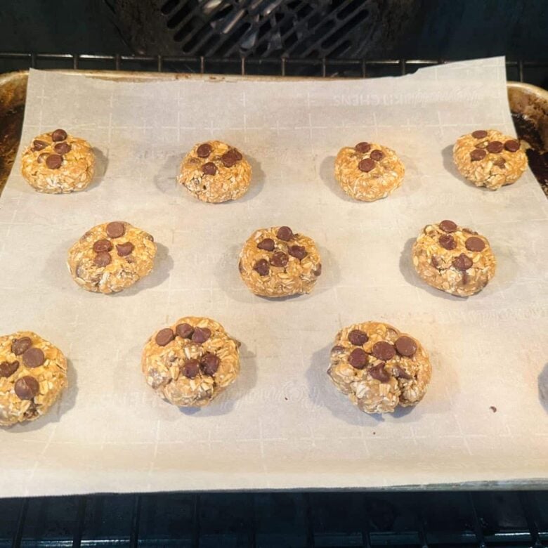 Oatmeal Chocolate Chip Cookies on Sheet Pan in Oven.