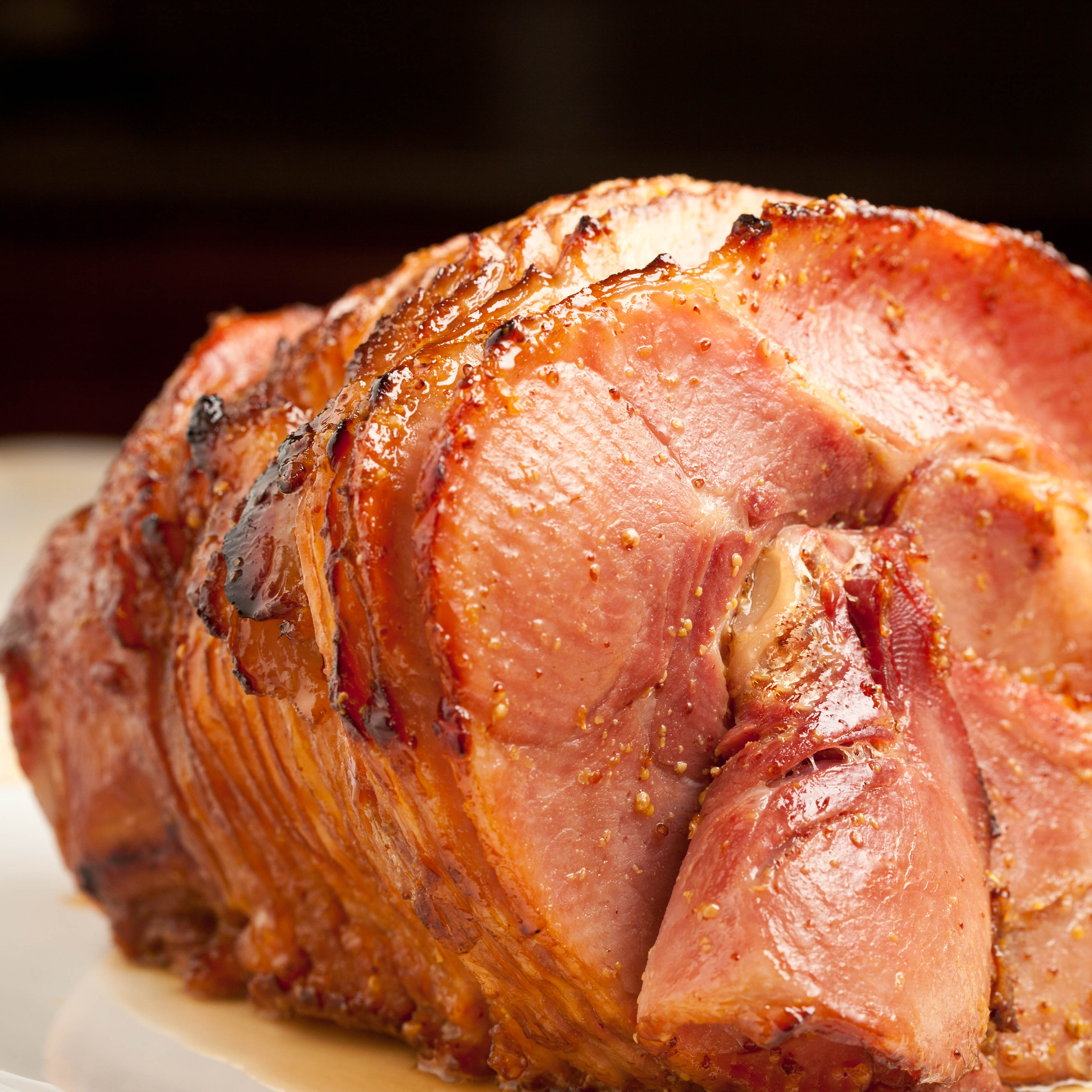 Honey Baked Ham Coming out of Oven