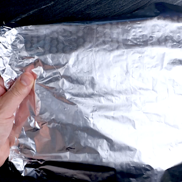 Strawberry icebox cake covered loosely with foil to chill it overnight in the fridge.