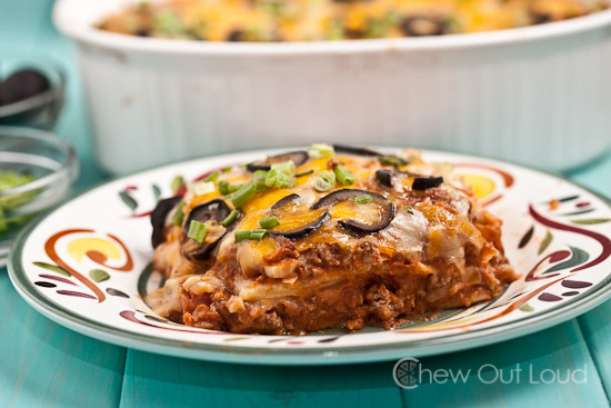 A plate of Enchilada with Sliced Olives and Onions