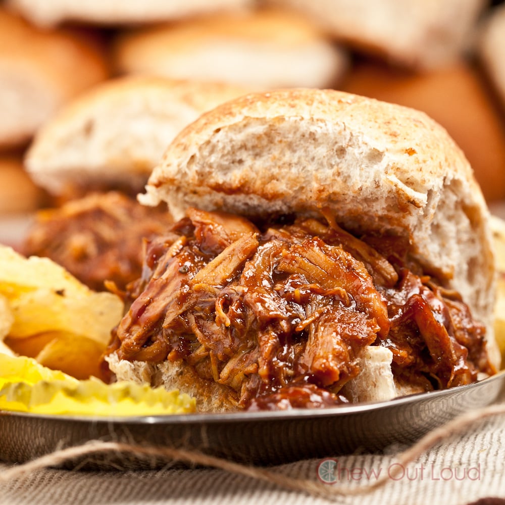 Smoky BBQ Pulled Chicken in bun with potato chips and pickles