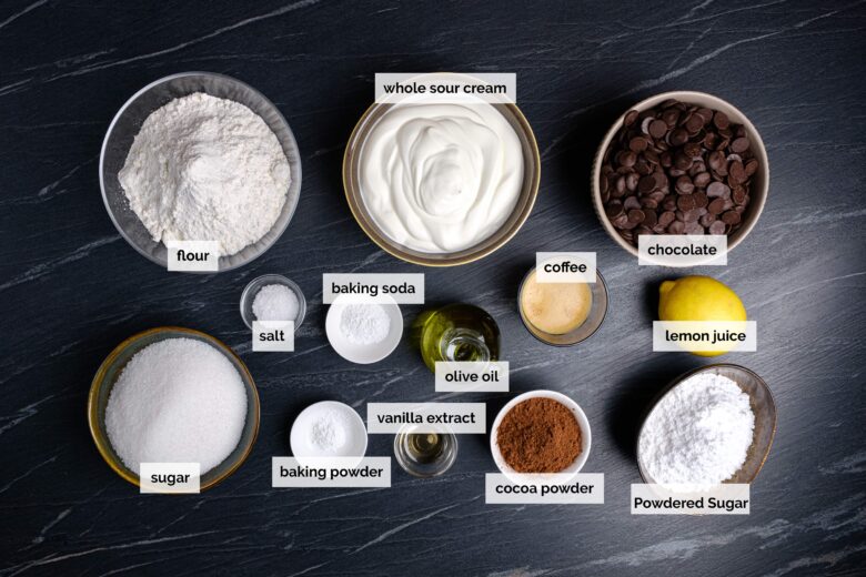 Ingredients for eggless chocolate cake like flour, sugar, and baking powder.
