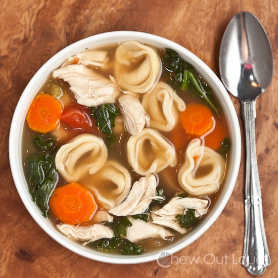 tortellini soup with vegetables in a bowl