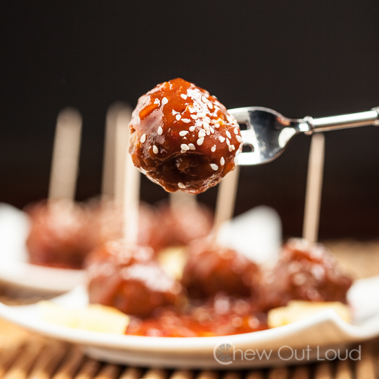 sweet and sour meatballs on fork