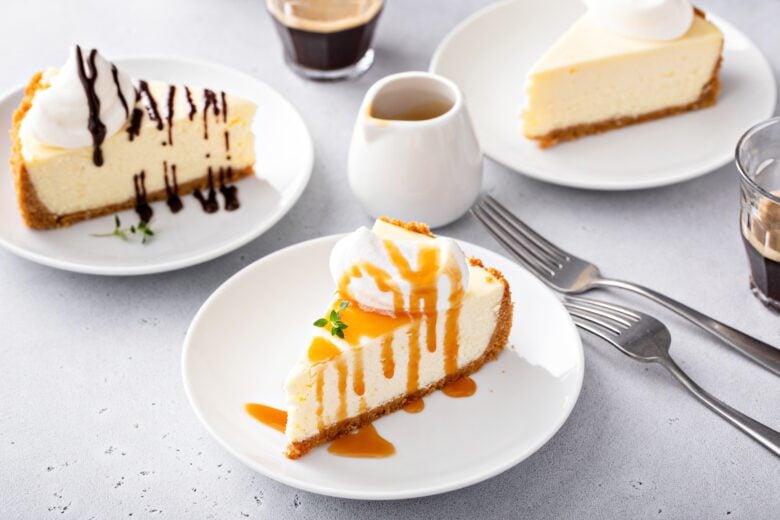 New York cheesecake slices with caramel sauce and fudge sauce