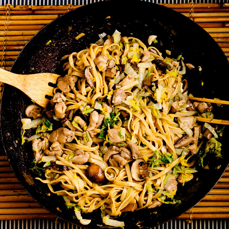 Chicken lo mein with napa cabbage in wok