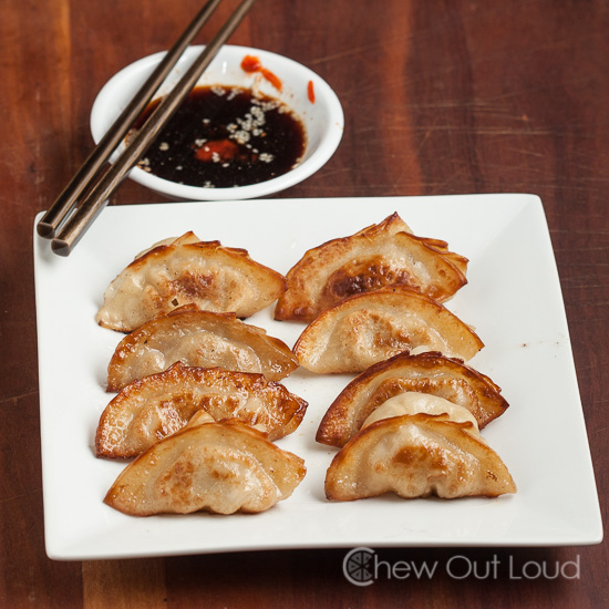 A Plate of Dumplings with Side Sauce