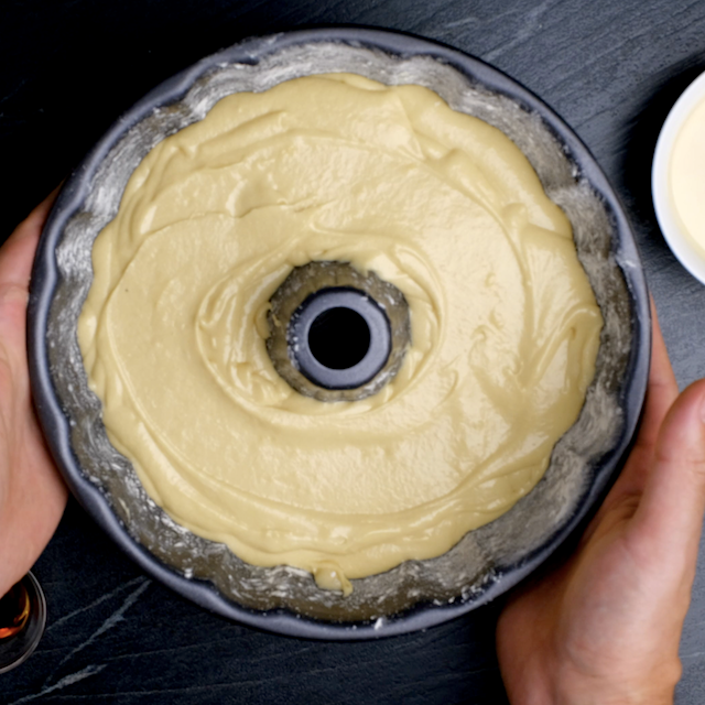 Brown sugar bundt cake batter in a bundt pan, ready to be baked.