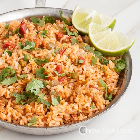 Mexican Rice with Chopped Cilantro and Sliced of Lime
