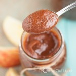 apple butter jam in a mason jar with a spoon