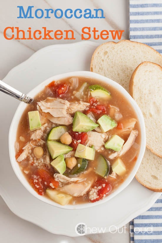 Moroccan Chicken Soup in white bowl with spoon and bread 