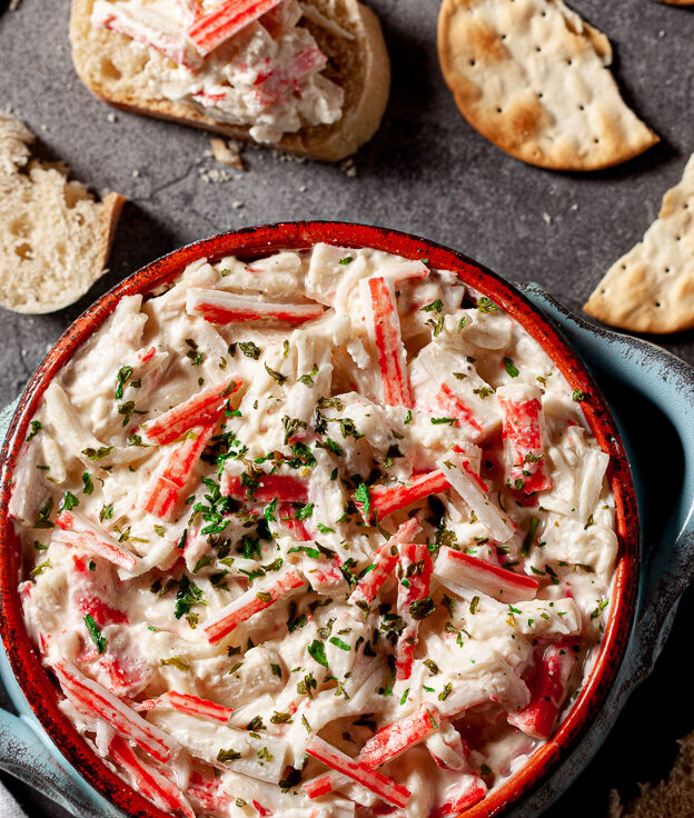 imitation crab dip in bowl with crackers