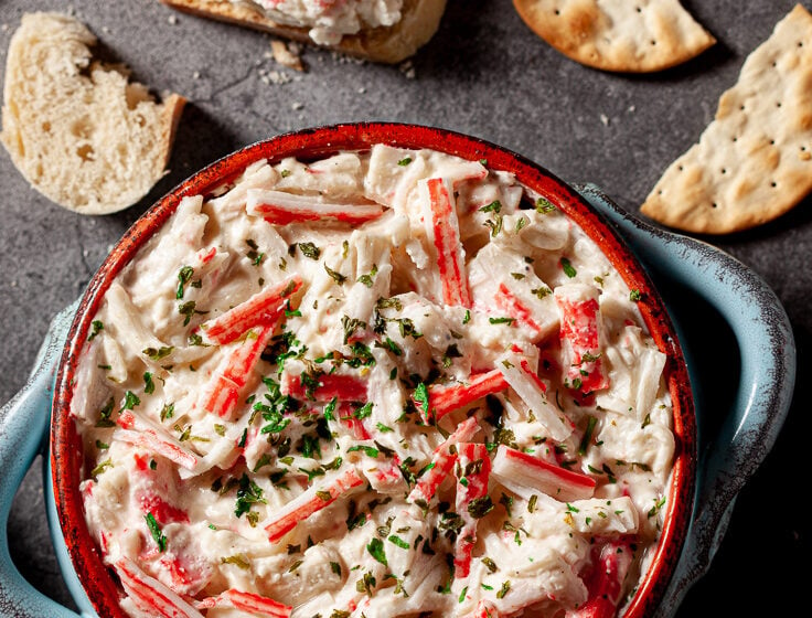 imitation crab dip in bowl with crackers