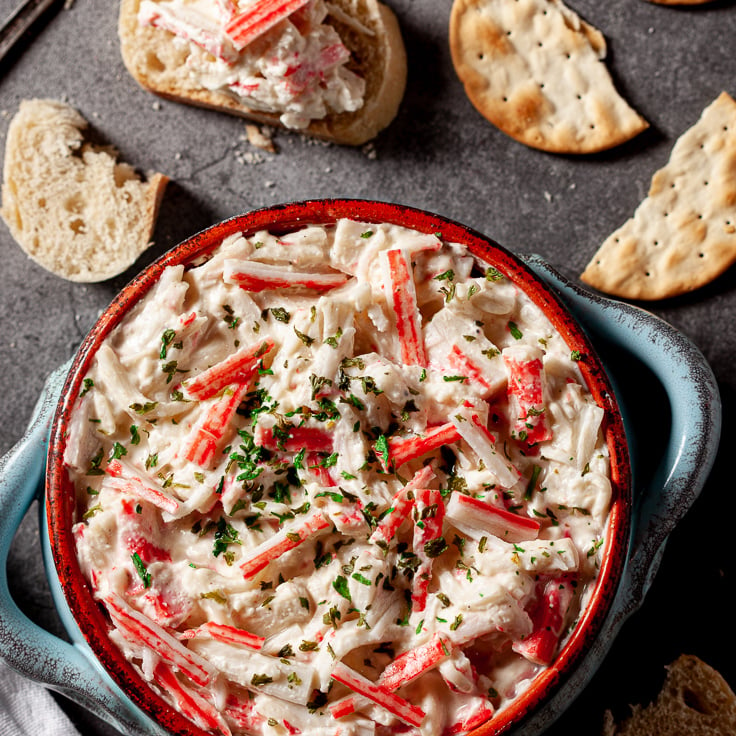 imitation crab dip in bowl with crackers