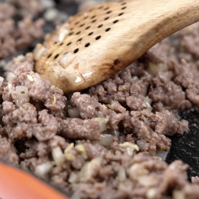Cooked sausage in a pan to make skillet lasagna.