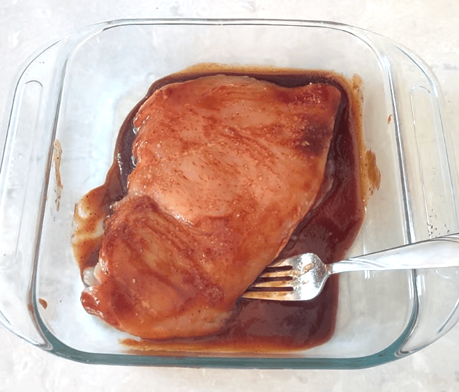 BBQ Chicken Salad Chicken breast marinating in BBQ sauce.