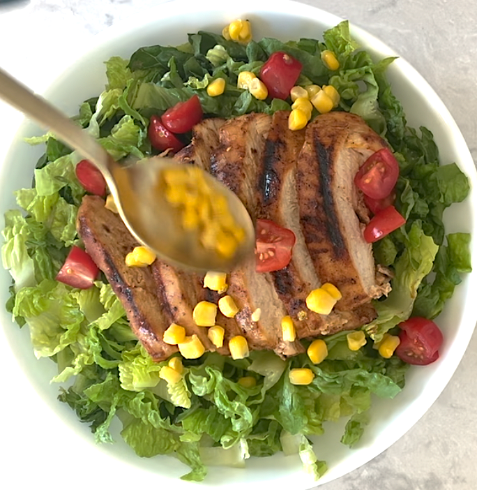 BBQ Chicken Salad drizzling of sauce and dressing.
