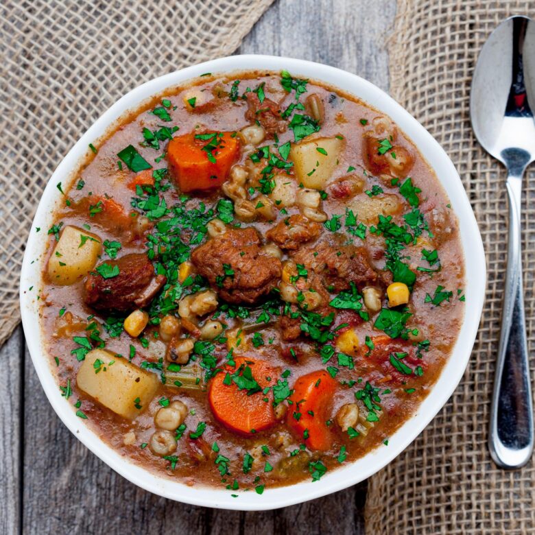 Beef and Barley Stew in a Bowl with Spoon.