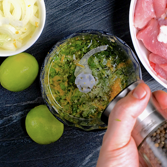 Overhead shot of ingredients to make Mojo sauce in a blender.
