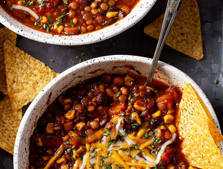 Lentil Chili with Black Beans in bowls with chips