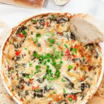 Baked Spinach-Artichoke Yogurt Dip with Sliced of Green Onions