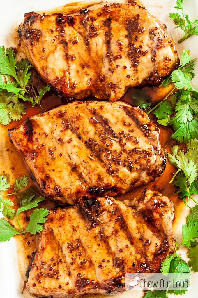 Grilled Pork Chops with Sauce and Parsley