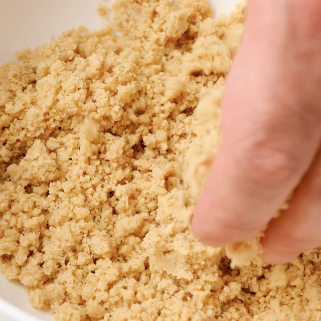 Streusel topping for apple coffee cake being prepared.