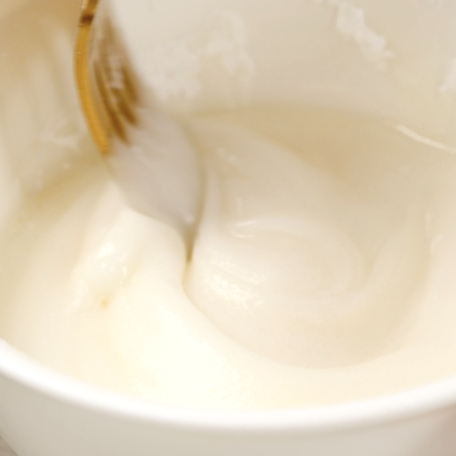 Apple coffee cake icing being prepared.
