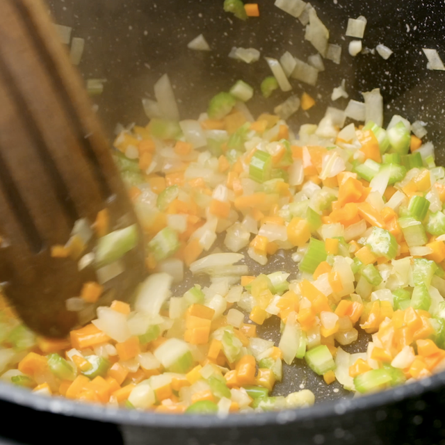 Aromatics and vegetables being sauteed to make turkey bolognese.
