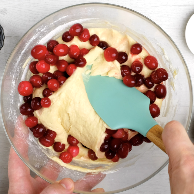 Fresh cranberries being folded in.