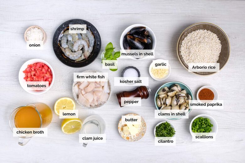 seafood paella ingredients including mussels, clams, fish, and shrimp. 