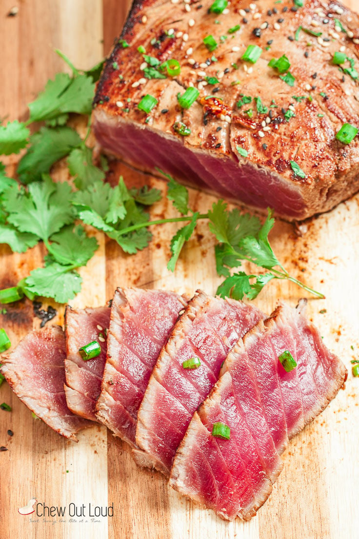 seared ahi tuna sliced on cutting board