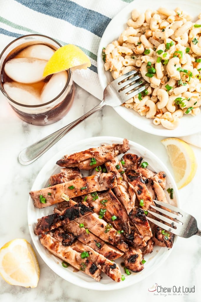 grilled chicken thighs with marinade on a white plate