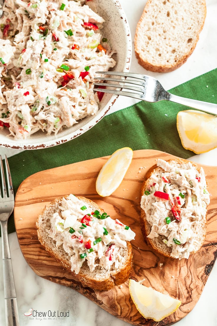 rotisserie chicken salad on bread with lemon slices