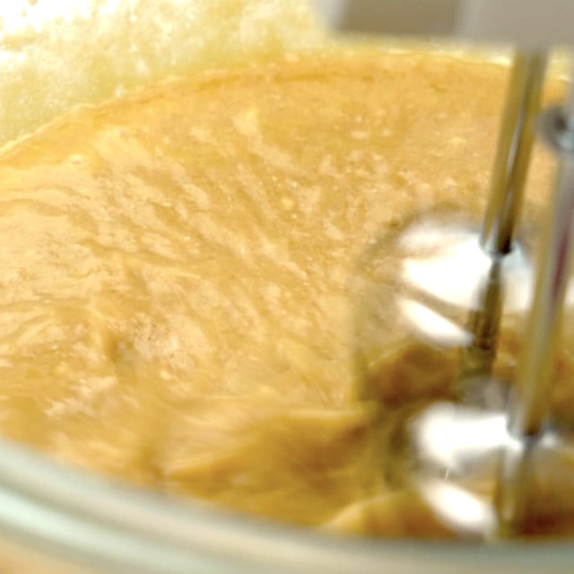 Pumpkin mixture being whisked to make pumpkin cornbread.