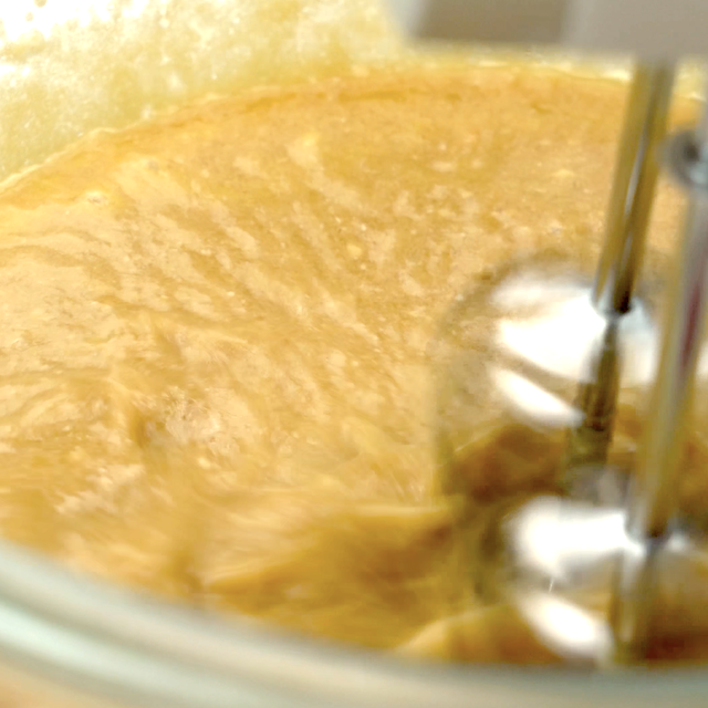 Pumpkin mixture being whisked to make pumpkin cornbread.